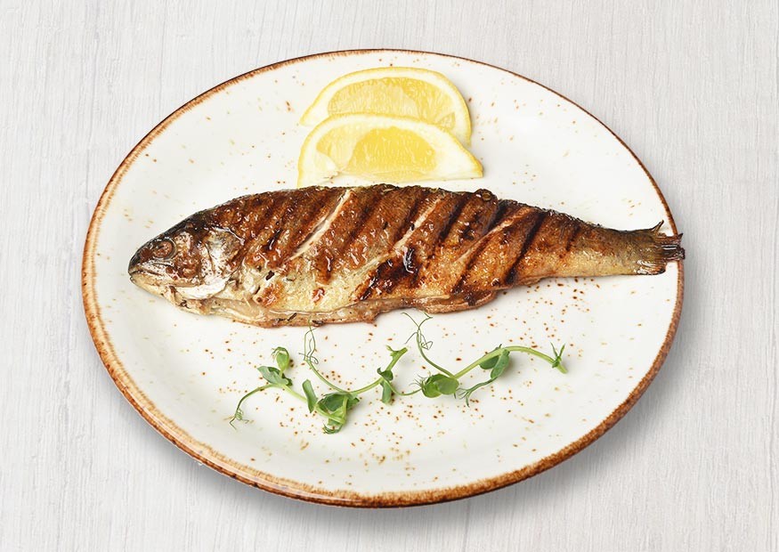 River trout roasted with fragrant herbs and lemon